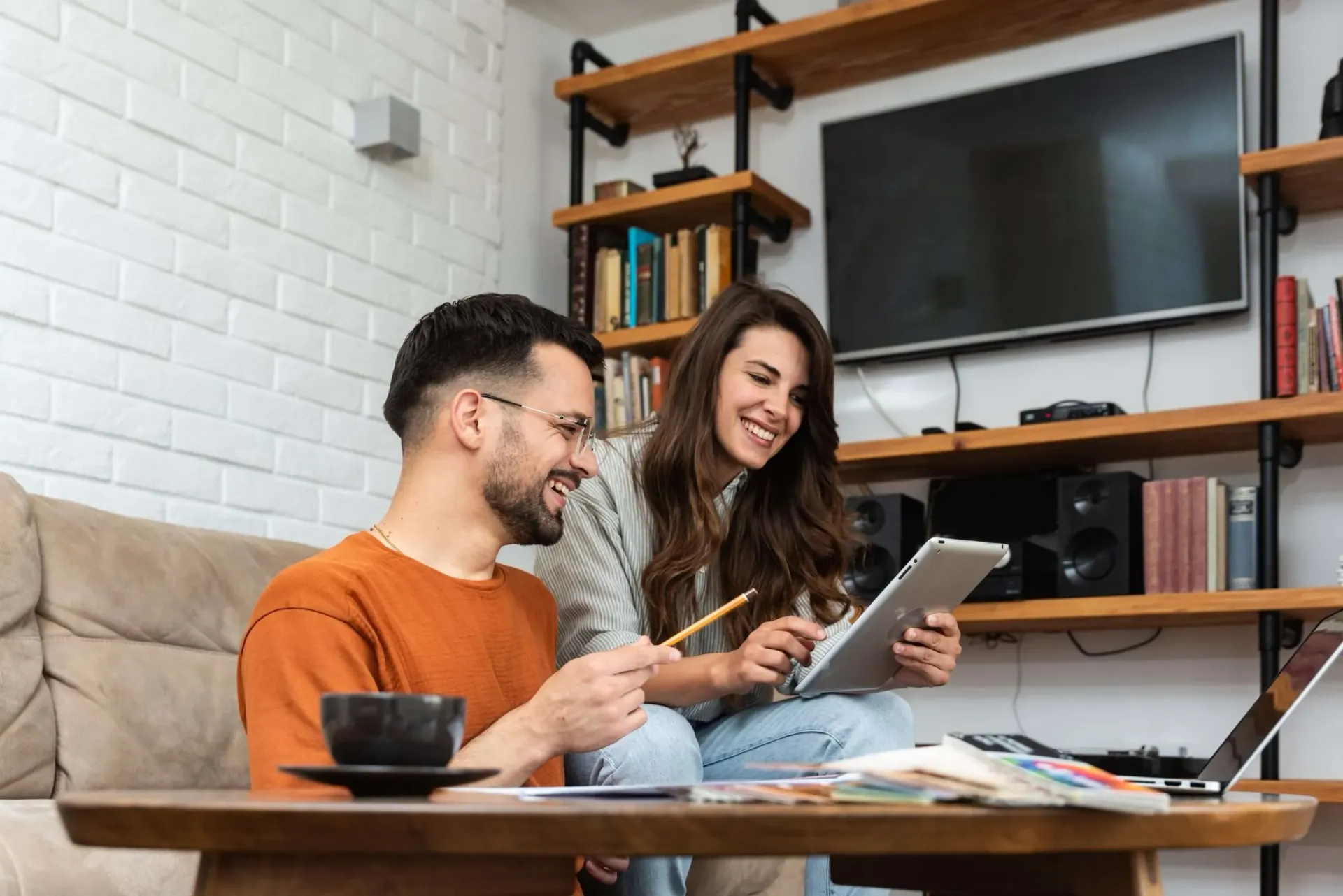 two people looking at a tablet