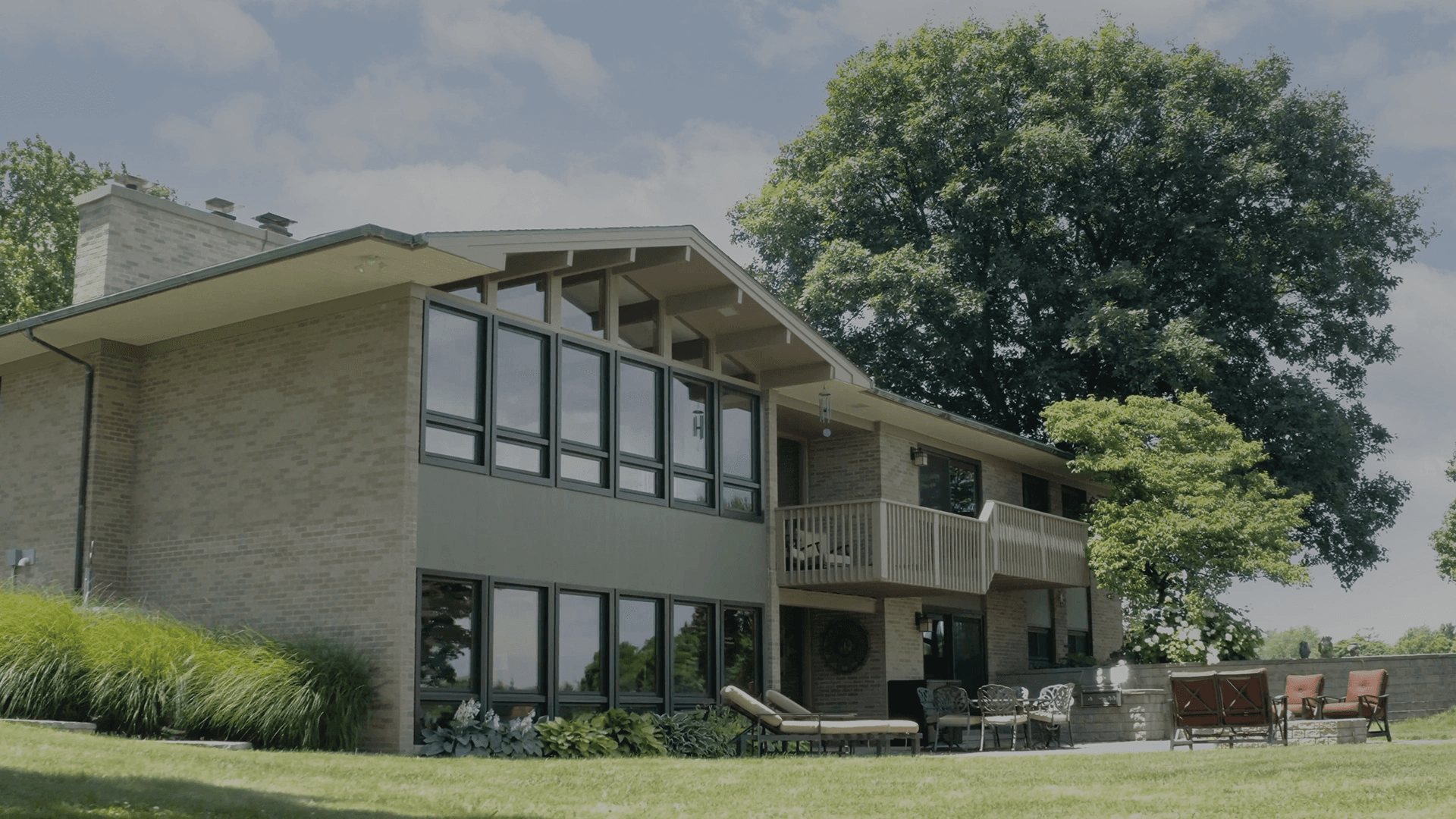 The exterior of a house with new Infinity Windows installed by RGS Exteriors.
