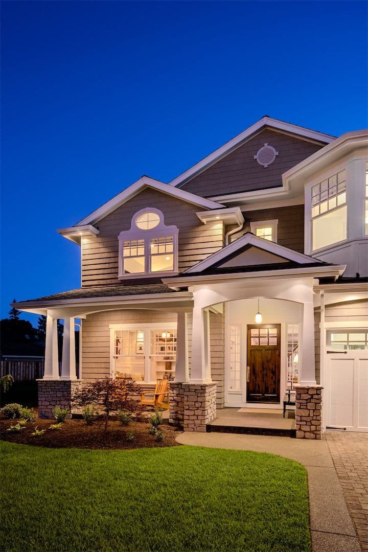 front of home lit up at night
